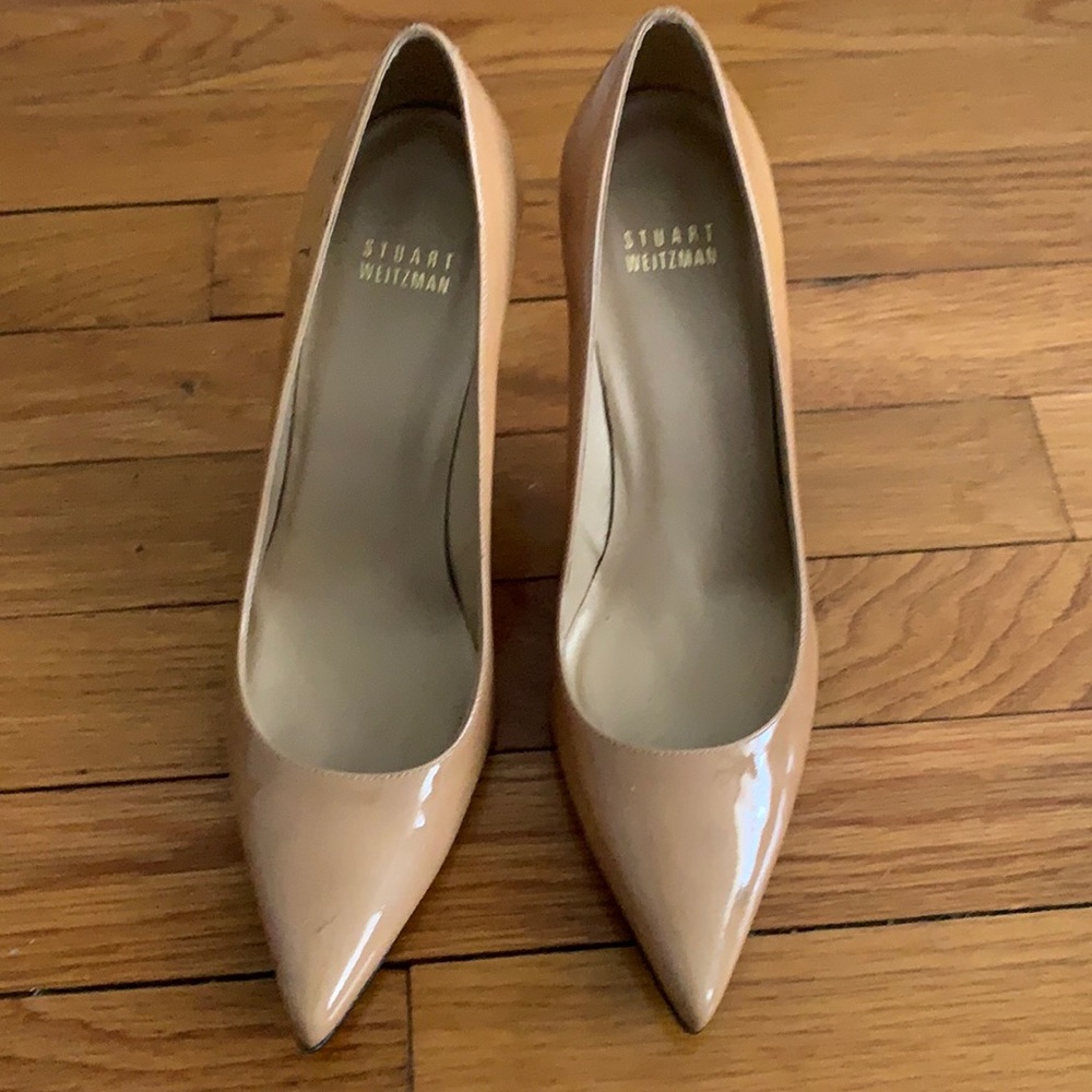 Stuart Weitzman nude patent leather pumps.  Barely worn.  Some scuffs in pic.